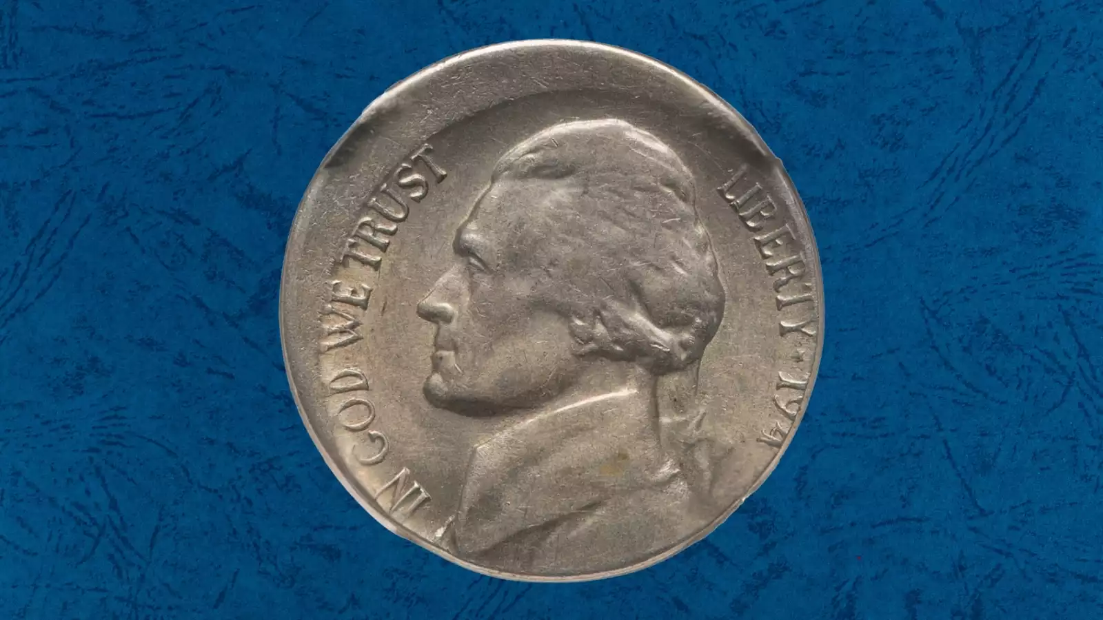 1949 Jefferson nickel off-center strike error showing approximately 50% misalignment with full date visible